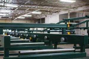 A picture of a custom-manufactured agriculture conveyor dries in the warehouse after a paint job.